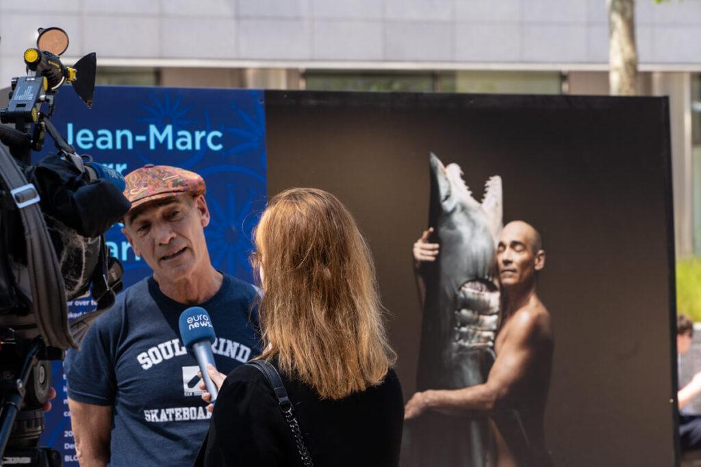 Jean-Marc Barr speaks to media at the exhibition